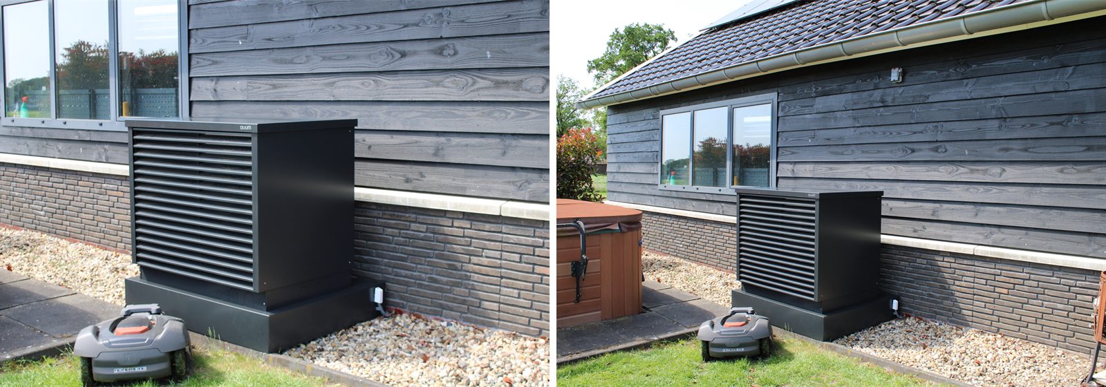 De zwarte Ovum AirCube op een sokkel tegen de donkere houten gevel van de garage
